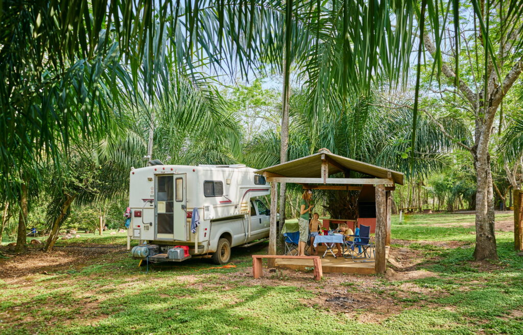 Campervan parked on campsite by picnic shelter, Bonito, Mato Grosso do Sul, Brazil, South America